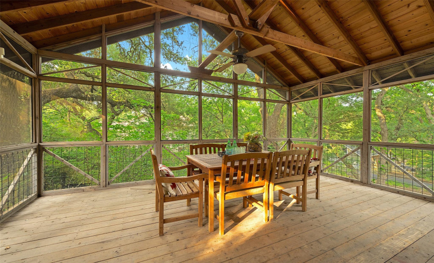 The adjacent screened-in porch beckons you to savor meals al fresco (and mosquito free!).  Embraced by trees, the porch is a literal treehouse where you can find solace and relaxation.  This sanctuary is soon to become one of your favorite rooms in the house.