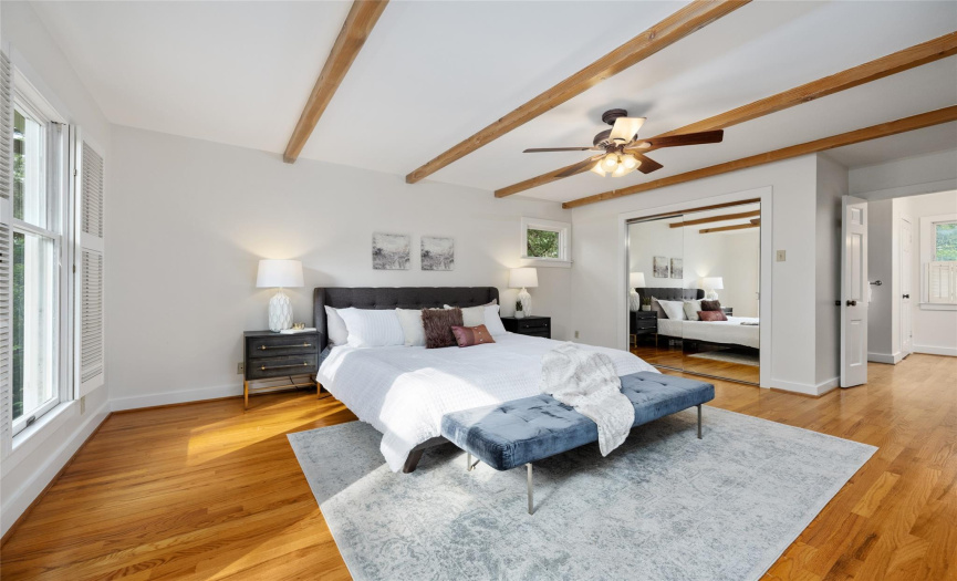 The expansive primary bedroom is a haven of tranquility with two closets, an en suite bath, and space for lounge furniture so that it can serve as a true retreat. 