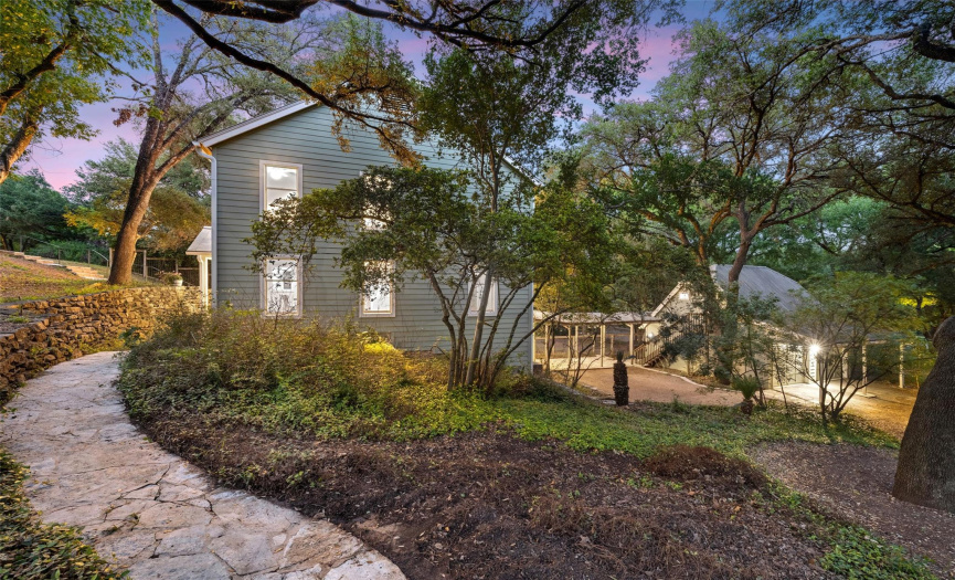 Built into the hillside, this three-story home is brimming with authentic Austin touches that give it a distinctive personality.  