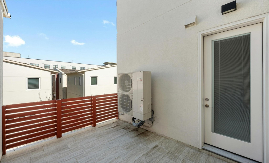 The breezy second floor terrace offers space for you to configure a nice little outdoor living/dining area. 