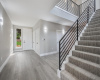 Foyer entry with tons of storage and beautiful staircase to the main level.