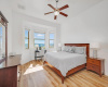 The primary bedroom has luxury plank floors and views of the Austin Hill Country. 