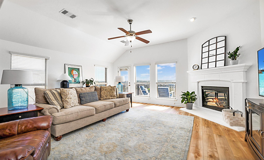 Enjoy the gas fireplace and views of the Austin Hill Country from the living room.