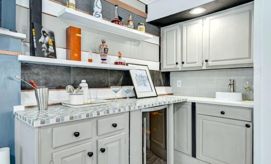There’s even a wet bar with a small vessel sink and beverage fridge, perfect for easy relaxing and entertaining.  