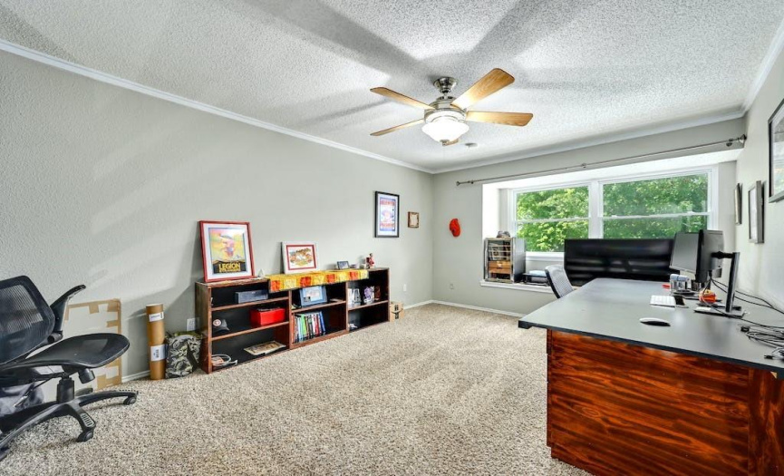 With carpeted floors and a large window, this flexible loft space has dynamic potential. Make it a home office, a game room, a home gym, or even a third living room. 