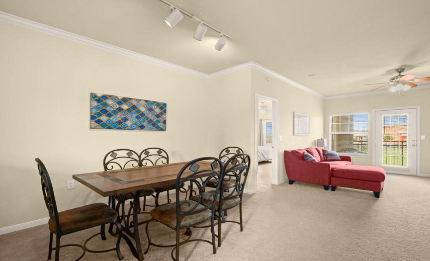 Gather around the dining area, seamlessly connected to the kitchen and living room, creating the perfect space for entertaining guests or enjoying meals with loved ones.