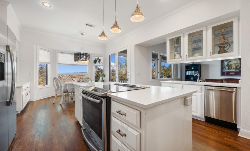 Enjoy cooking in this gourmet kitchen while taking in the views and never missing a beat as it opens to the family room.