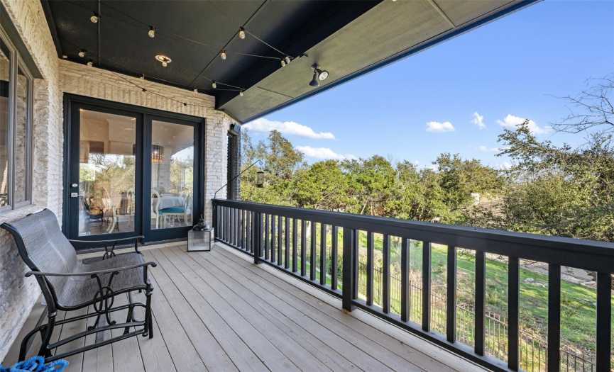 What a great spot to hang out! This upper deck is right off the breakfast/casual dining room and main living areas. Enjoy the cool breezes and Hill Country views. 