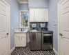 Laundry room full of design and function. Tons of extra storage space!
