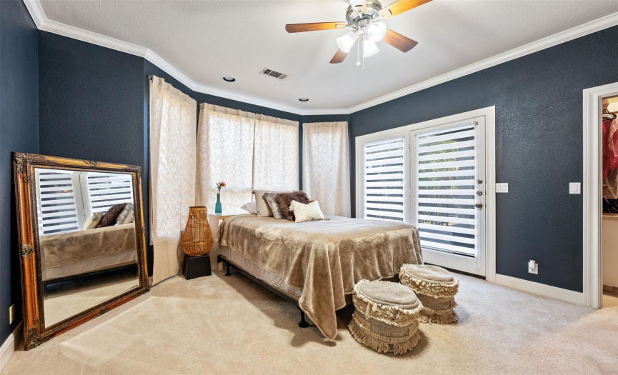 This lower level bedroom would also make an excellent 3rd living area, media room, office, exercise room, etc. It has covered patio access and a wet bar in the closet with extra built-in storage. 