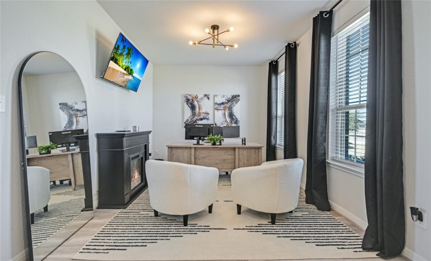 This home office is designed to allow you to be very productive when working on important deadlines or on a Zoom meeting. Problem solve a challenging task while looking out the windows facing the front lawn to help stay focused and on track.
