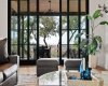This fantastic wall of sliding glass doors allows  for ease in indoor/outdoor living. 