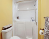 Relax in the walk-in tub/shower combo.
