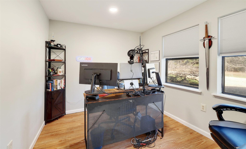 This versatile home office/flex room showcases vinyl flooring, offering a contemporary and functional workspace for productivity and creativity.