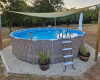 Host memorable gatherings and splash in the above ground pool in this serene outdoor retreat.