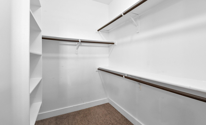 Primary Walk In Closet.  Plenty of space for all your clothes.