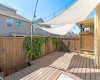 Alternate angle of patio; showcase the patio in relation to back fence and neighbors.