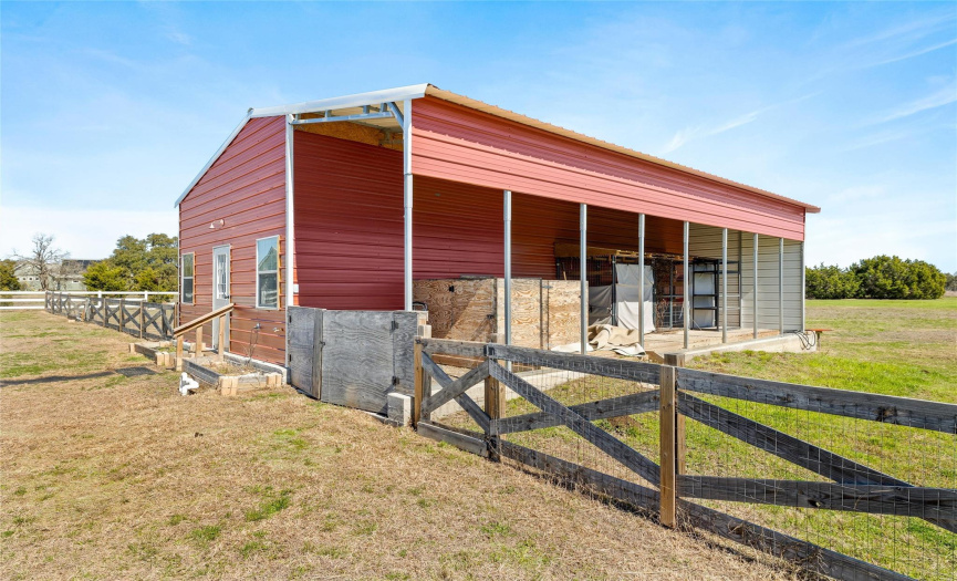The back building/barn was added in 2021 and is partially finished with a half bath and insulation.