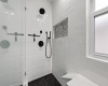 Shower with beautiful tile work.