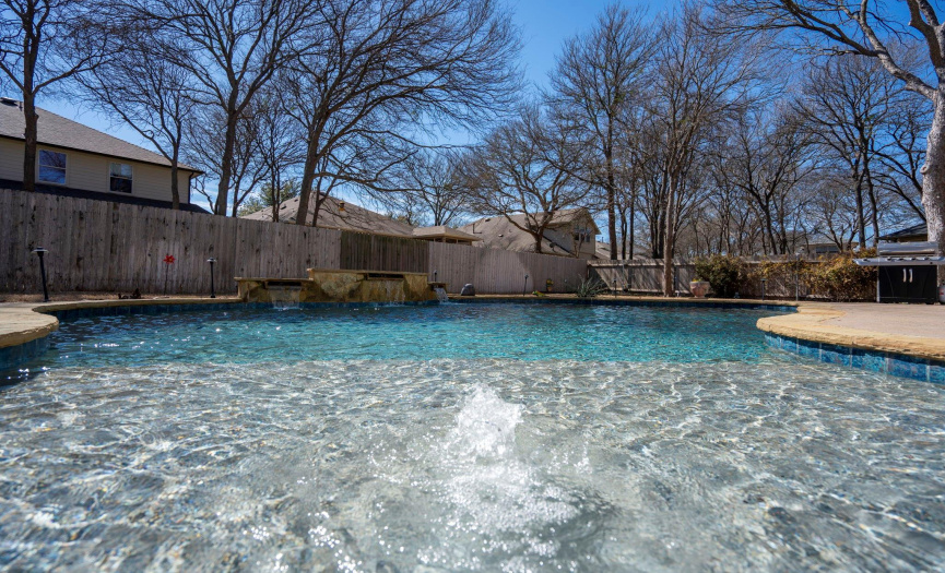 Sparkling pool features waterfalls, bubbler and goes to 6 ft deep.