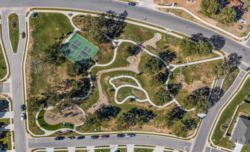 The Lake House includes: playground, pickleball courts, paved bike/skate course, provided shade from beautiful trees, and lots of open play space.