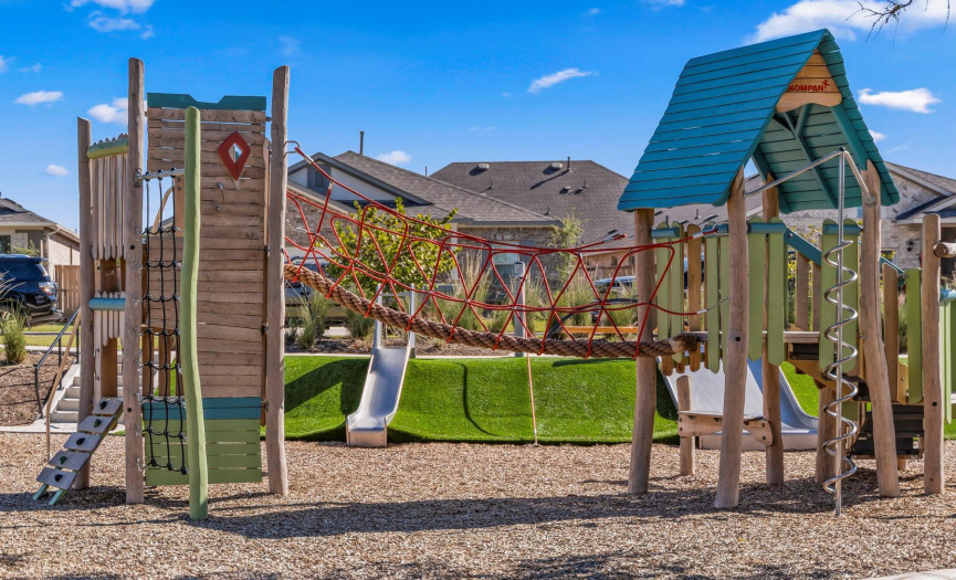 Playground located at The Lake House includes slides, monkey bars, climbing area, and swings!