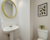 Th half bathroom is situated on the 1st floor and is perfect for guests.