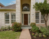 Views of the gorgeous flower bed and harmonious front entry.