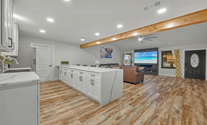 The kitchen and living room open concept floor plan is perfect for staying connected with everyone in your home and is also great for entertaining your guest or a place for your customers and clients to feel comfortable.