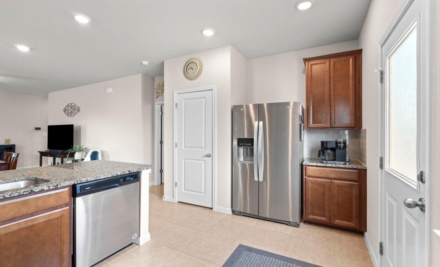Recessed lighting in the kitchen and dining areas.
