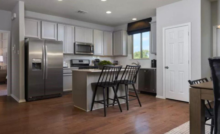 Photo of Pulte model home with same floor plan, not of actual home listed.