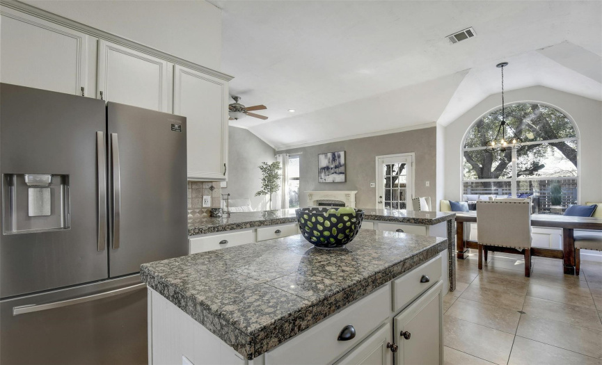 A closer look at the kitchen reveals the attention to detail, from the sleek countertops to the stainless steel appliances, promising a culinary haven for the discerning chef.