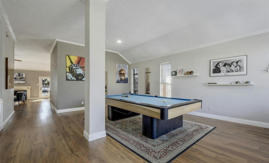 As you step inside, you're greeted by a vast living or game room, perfectly suited for entertaining & large enough to accommodate a 9-foot pool table.