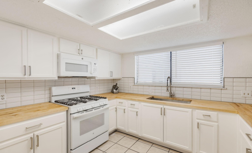 Unit A recently upgraded kitchen with new cabinets, countertops and sink/faucet!