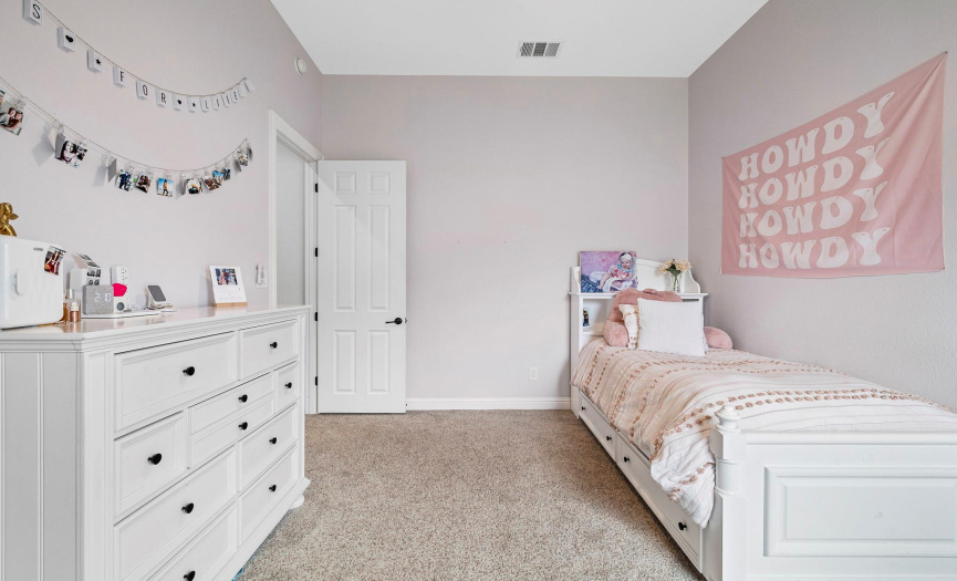 Secondary bedroom with walk-in closet