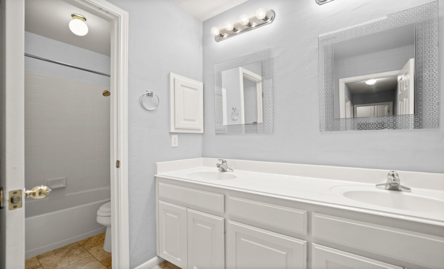 Hall bath with double vanity and separate water closet
