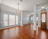 Inviting entry has wood floors and leads to combo formal living/dining area