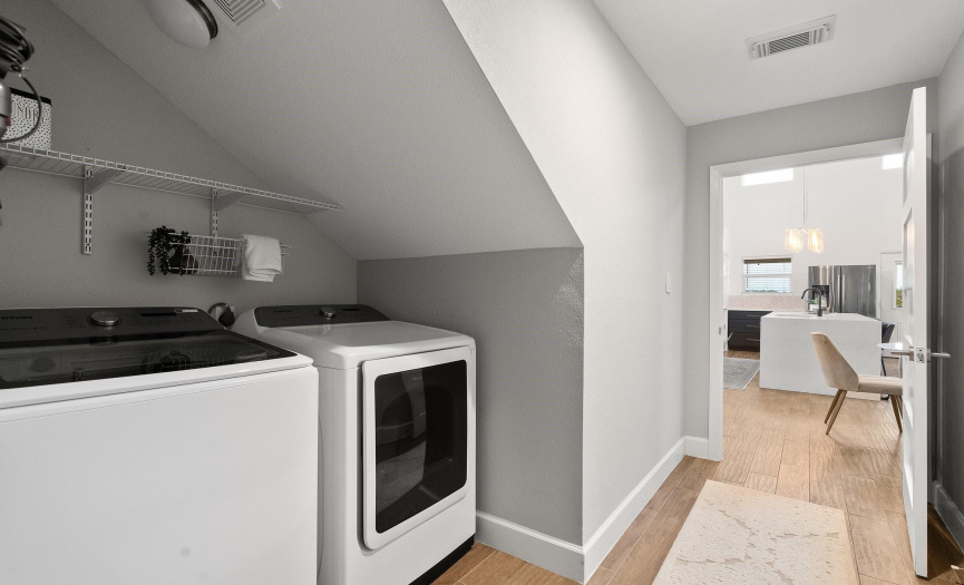 The laundry room is a functional and versatile space, well- equipped to handle all your laundry needs.