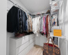 The walk-in closet provides ample space to organize your belongings, ensuring both convenience and accessibility.