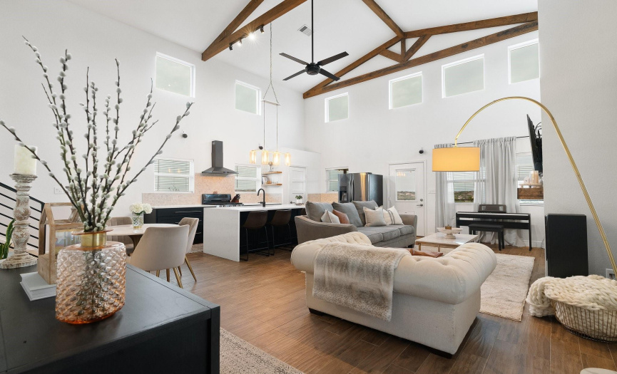 The open concept design allows family and friends to stay engaged whether they are enjoying a snack in the breakfast area, moving about the kitchen preparing meals, or lounging in the living room while watching a movie or the big game.