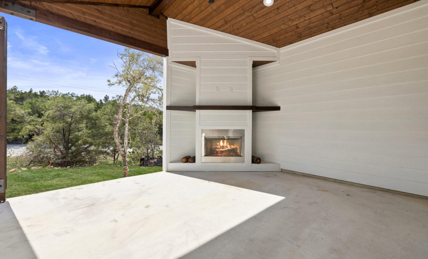 Indulge in the ultimate outdoor experience with this picturesque patio oasis. Covered for year-round enjoyment, this outdoor haven boasts a charming fireplace, perfect for cozy gatherings under the vast Texas sky.
