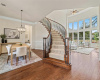 Welcoming winding staircase and rich hardwood floors