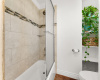 Shower/Bath combo with beautiful tile accents