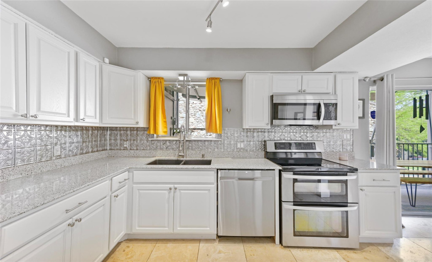 Great kitchen space with quartz countertops and plenty of storage.