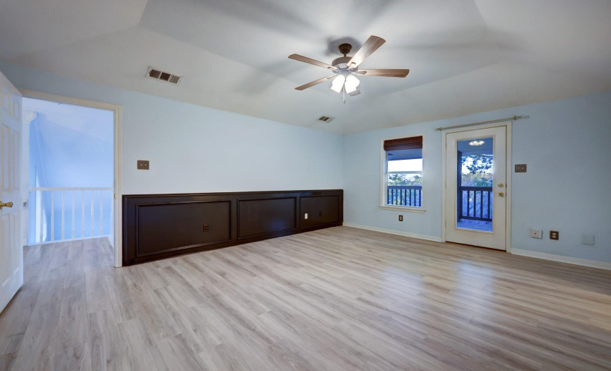 Expansive primary bedroom with the stunning view of lake travis.