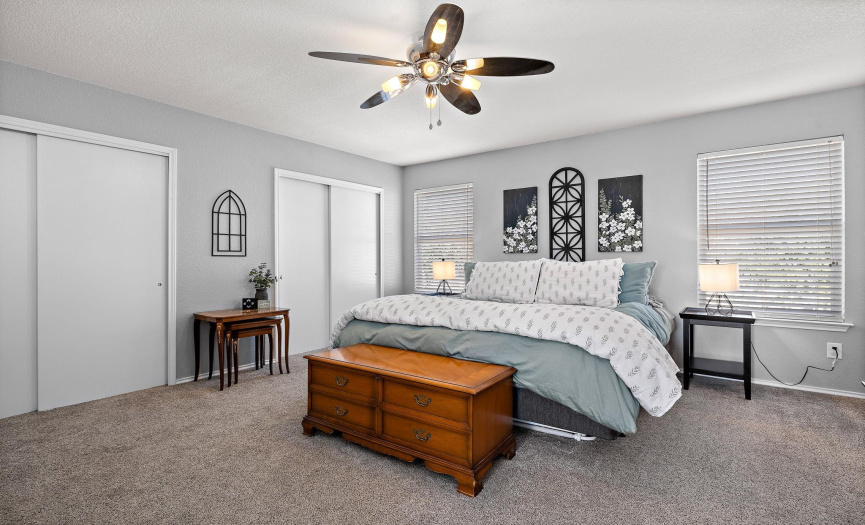 Large primary bedroom with updated lighting and 2 closets. 