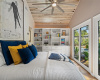 Incorporated built-ins for additional storage, a wooden shiplap ceiling, and a sizable ceiling fan