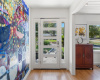 Enter through the front door and be welcomed by the most stylish art accent wall
