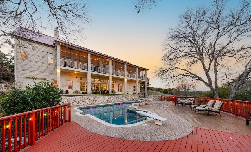 Relax in the pool and hot tub. Spacious deck provides plenty of room for entertaining.