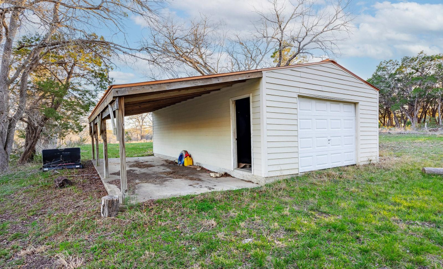 Additional storage shed on the property. Great for storing a tractor or riding mower and other equipment.